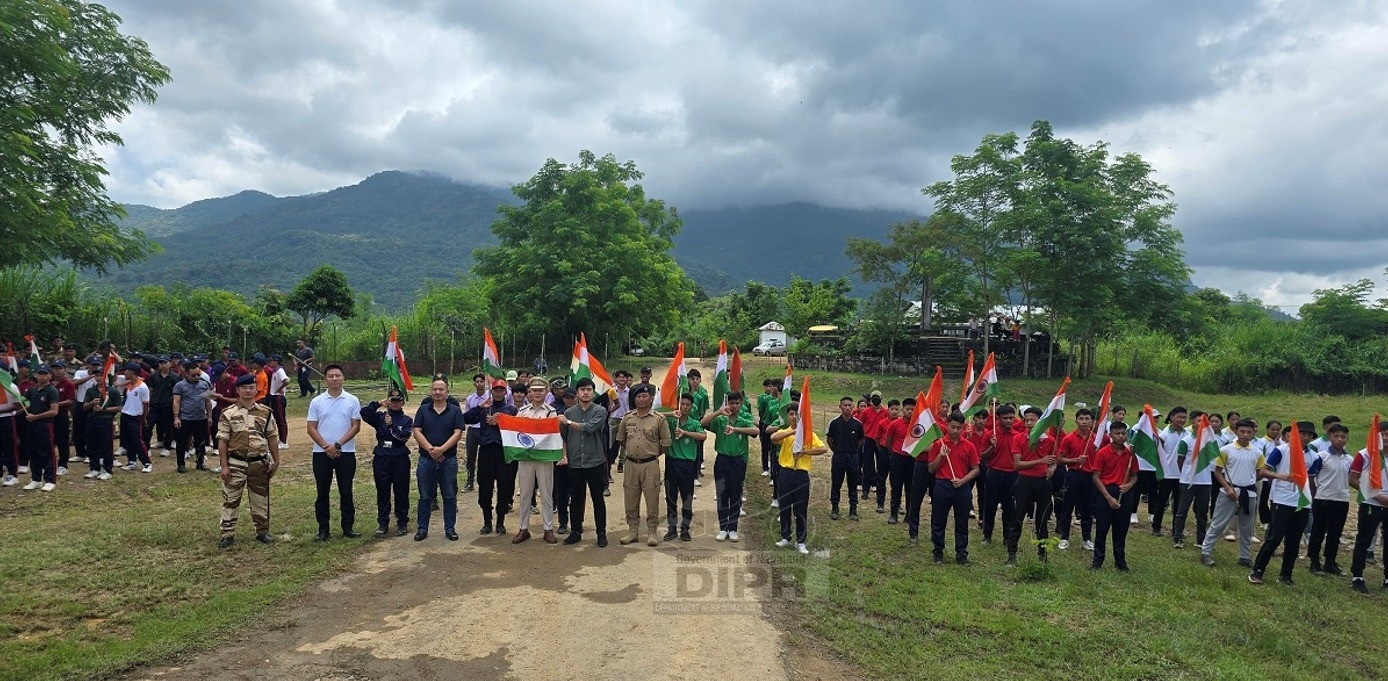 The parade contingent holding Indian flags in support of 3rd edition of the Har Ghar Tiranga Abhiyan during their Parade practice ahead of the 78th Independence Day at Peren