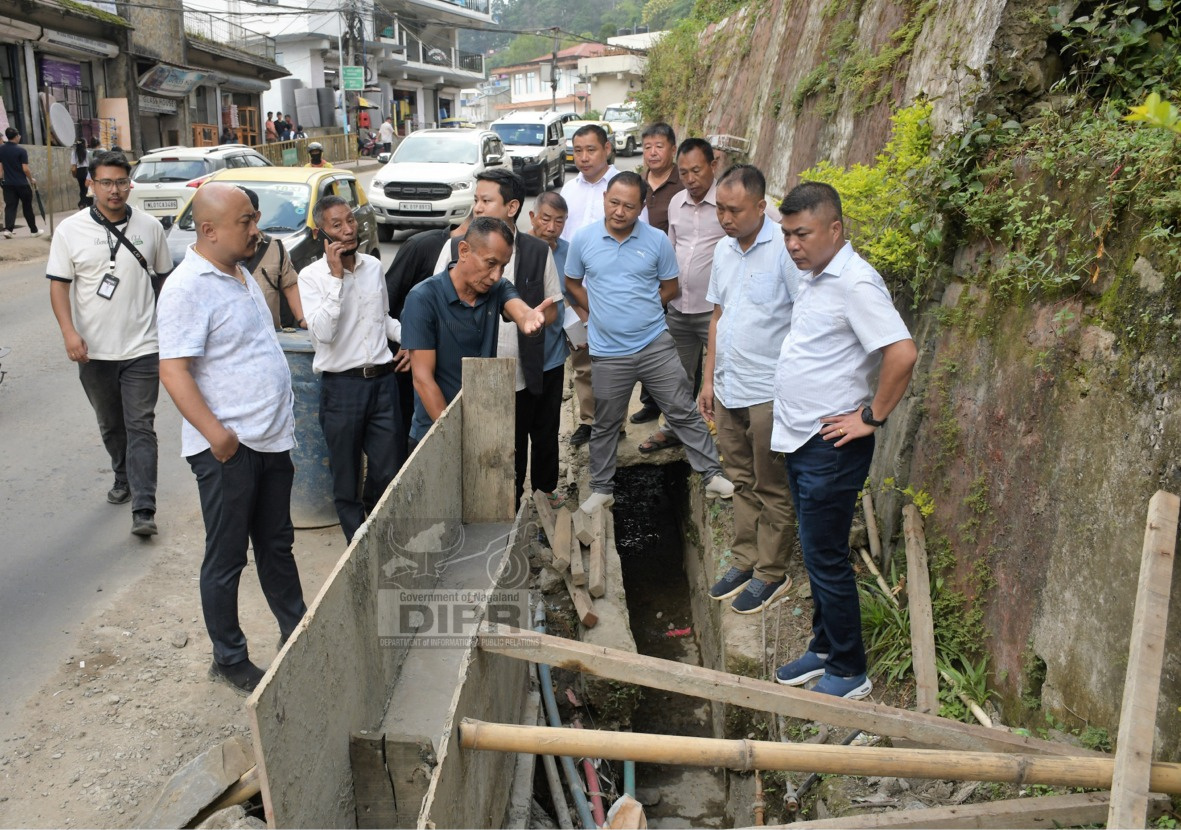 DC KOHIMA INSPECTS CLEARING OF DRAINAGE NEAR WAR CEMETERY