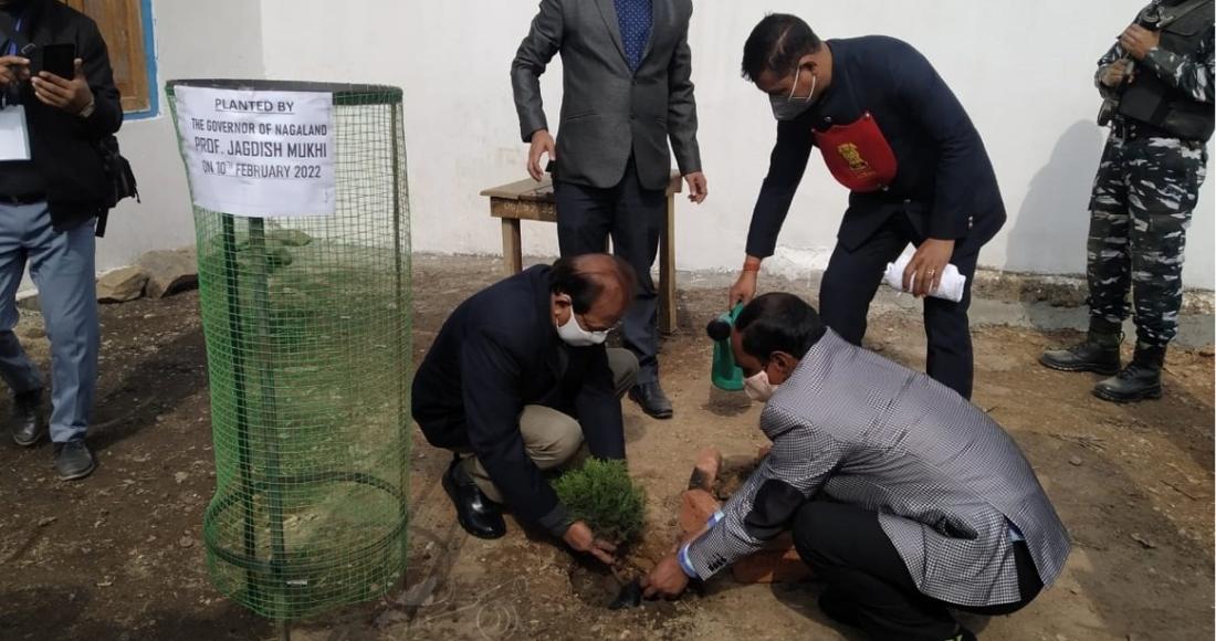 Prof Jagdish Mukhi is seen planting a tree at Government Higher Secondary School Kiphire