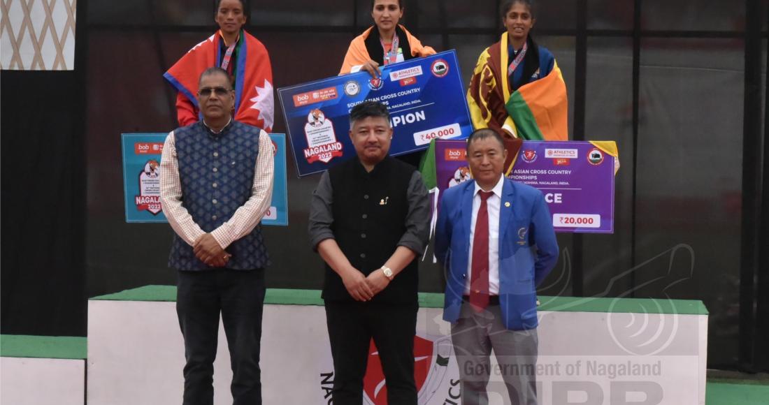 Associate Vice President AFI, Abu Metha and dignitaries with the winners of Women (10km) SAAF and National event at IG stadium, Kohima