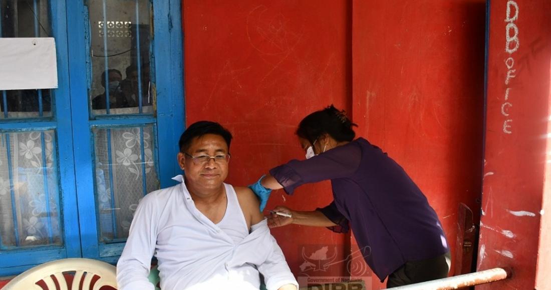 Mhathung Yanthan receiving the booster dose at Wokha