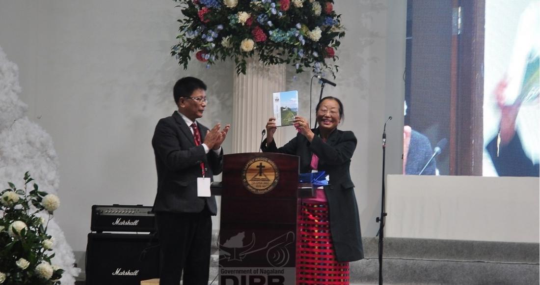 L. Bendangla Jamir releasing the ABAM Sesquicentennial Celebration Souvenir at Impur