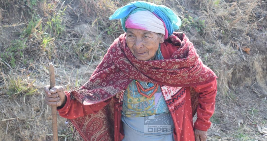 A senior citizen proceeding towards the Polling Station to cast her vote at 71-Peren