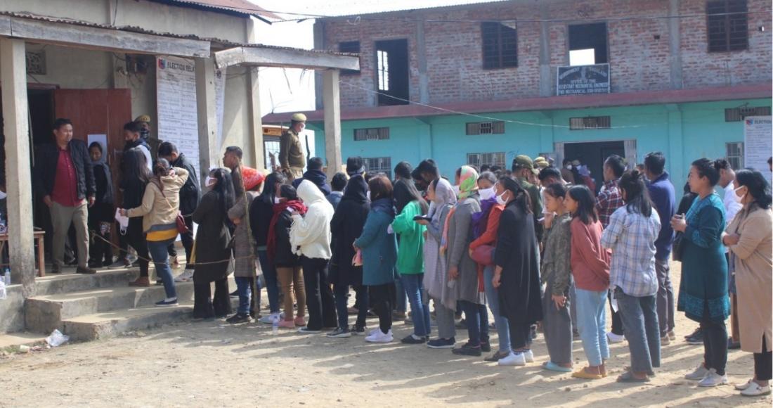 Voters stands in queue to cast their votes at Zunheboto