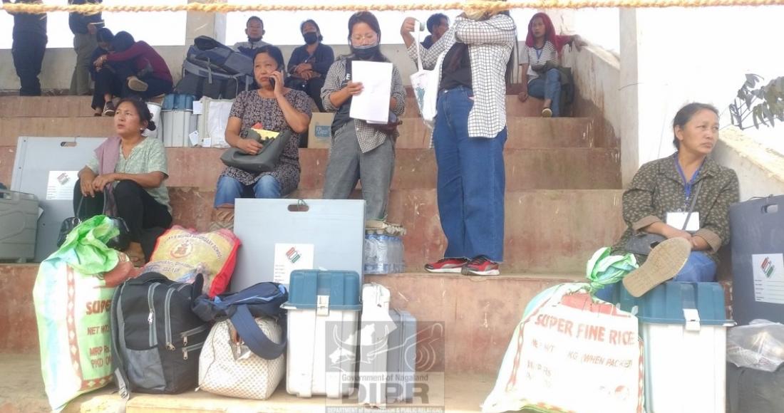 Women polling personnel waiting at vehicle transit camp at Longleng