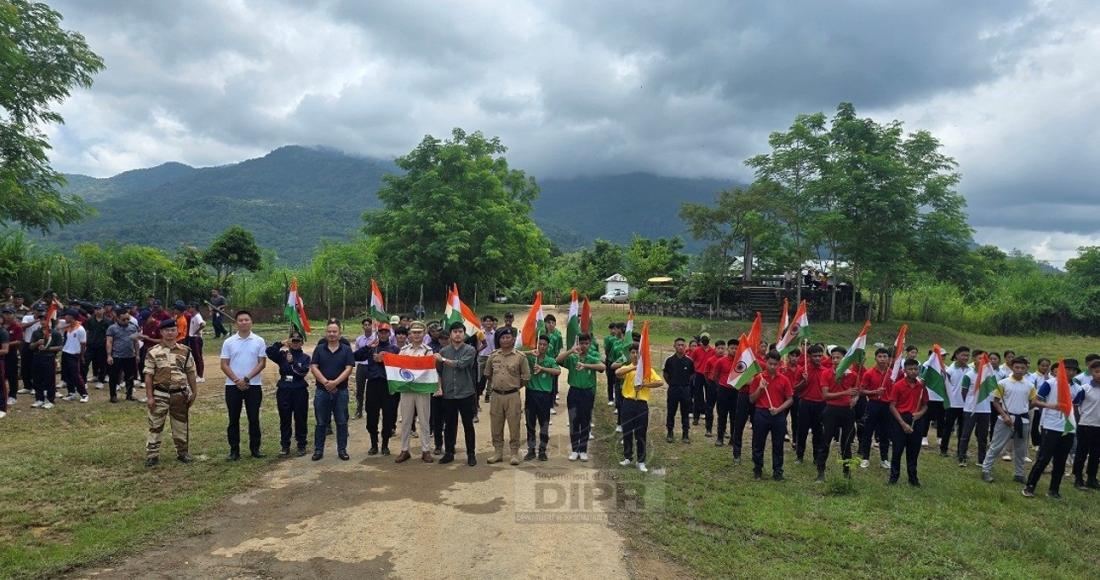 The parade contingent holding Indian flags in support of 3rd edition of the Har Ghar Tiranga Abhiyan during their Parade practice ahead of the 78th Independence Day at Peren